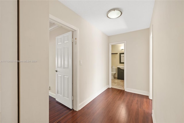 hall with dark hardwood / wood-style flooring