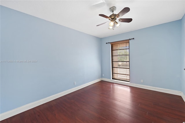 unfurnished room with dark hardwood / wood-style floors and ceiling fan