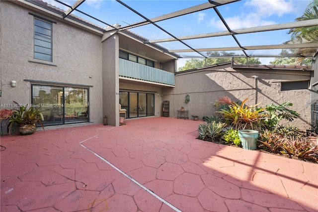 view of patio / terrace featuring a lanai