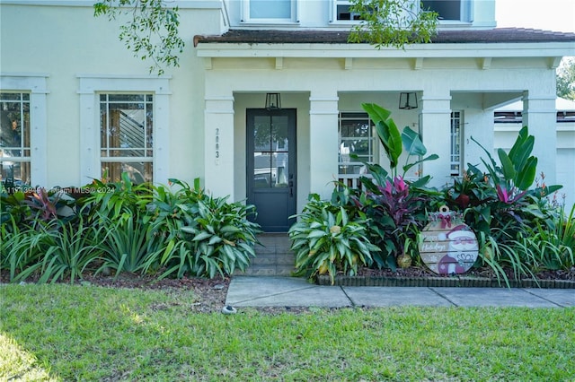 entrance to property featuring a porch