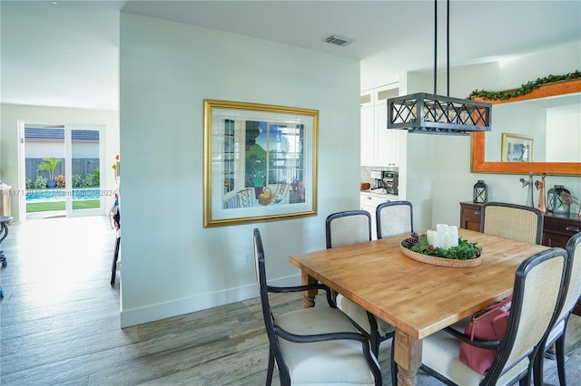 dining room with light hardwood / wood-style flooring