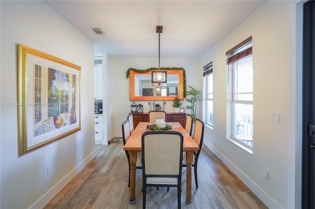 dining area featuring dark hardwood / wood-style floors