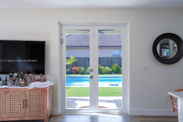 doorway to outside featuring hardwood / wood-style floors and plenty of natural light