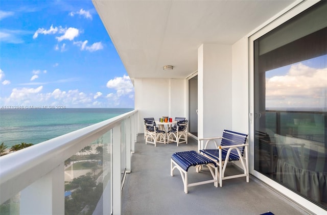 balcony featuring a water view