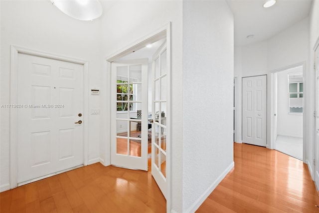 foyer featuring french doors and light wood-type flooring