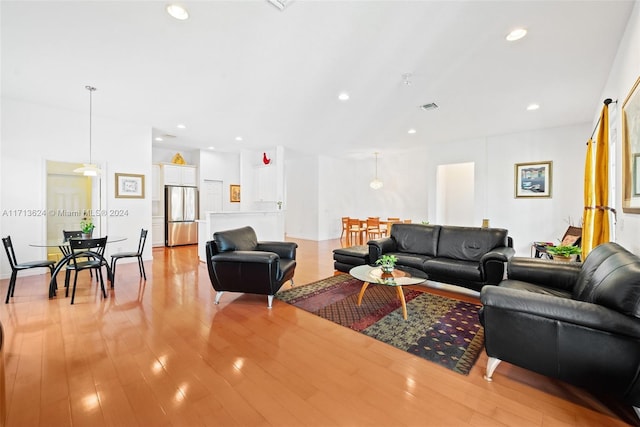 living room with light hardwood / wood-style flooring