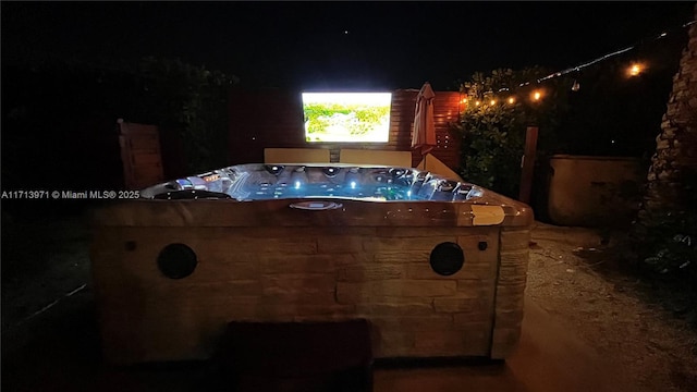 exterior space with a hot tub