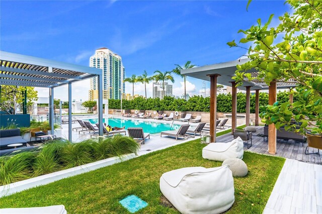 view of swimming pool featuring a yard, a pergola, and a patio