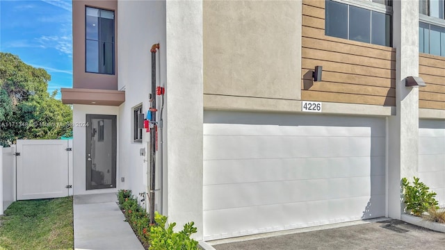 view of exterior entry with a garage