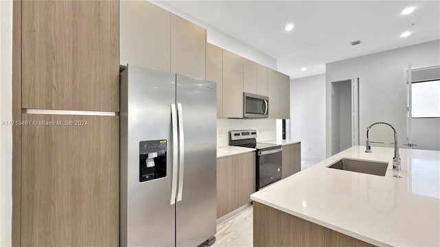 kitchen featuring tasteful backsplash, sink, stainless steel appliances, and light brown cabinets