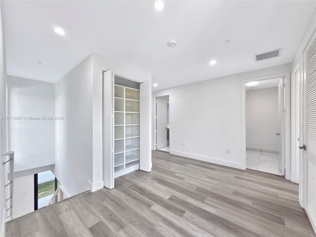 unfurnished room featuring light hardwood / wood-style floors