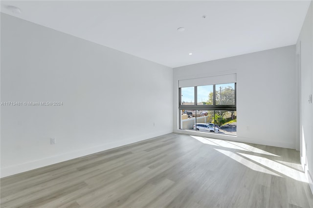 unfurnished room featuring light hardwood / wood-style flooring