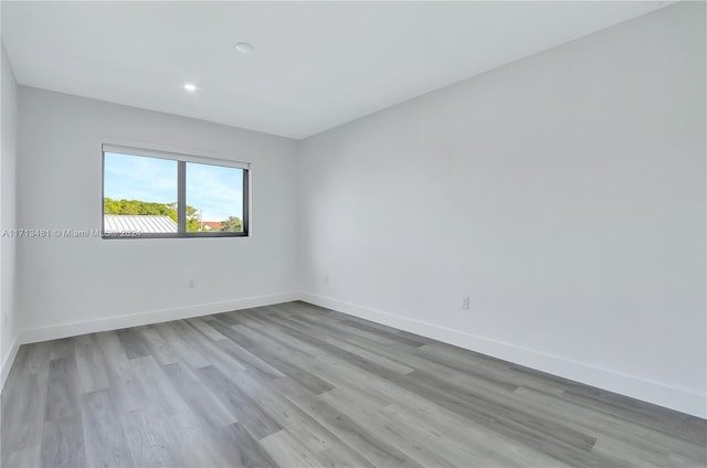 unfurnished room with light hardwood / wood-style flooring