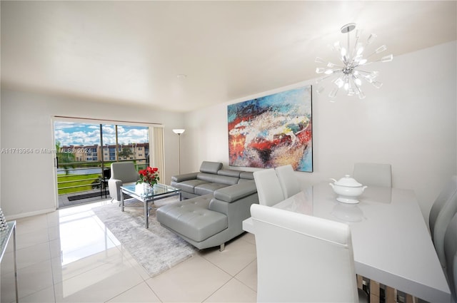 living room featuring a chandelier and light tile patterned flooring