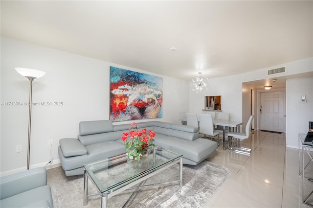 living area with baseboards, visible vents, a chandelier, and light tile patterned flooring