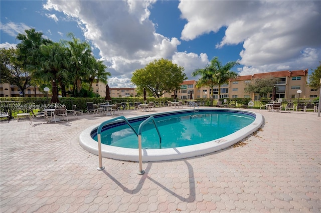 view of swimming pool with a patio area