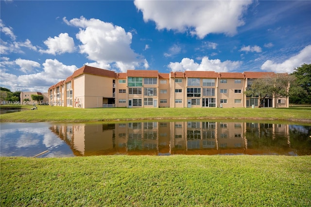 view of building exterior with a water view