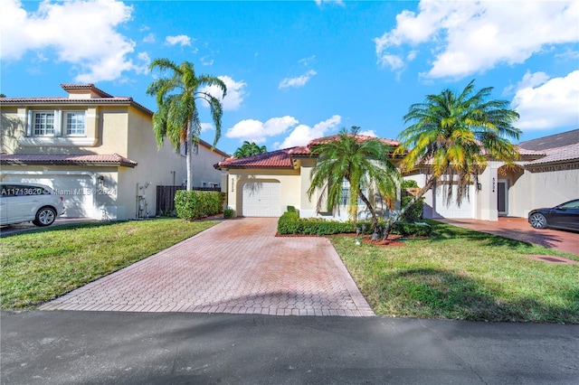 mediterranean / spanish house featuring a front yard