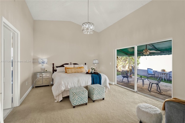 carpeted bedroom featuring access to exterior, lofted ceiling, and a notable chandelier