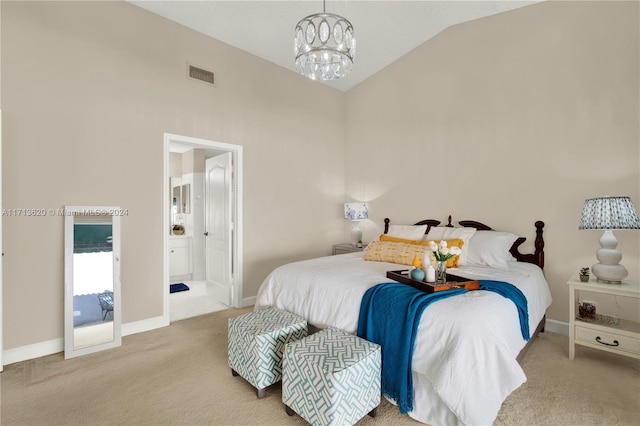 carpeted bedroom with high vaulted ceiling, connected bathroom, and a chandelier