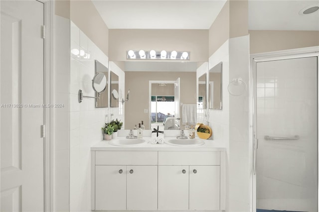 bathroom featuring vanity and an enclosed shower