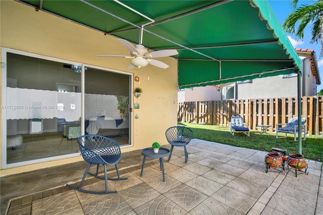 view of patio / terrace featuring ceiling fan