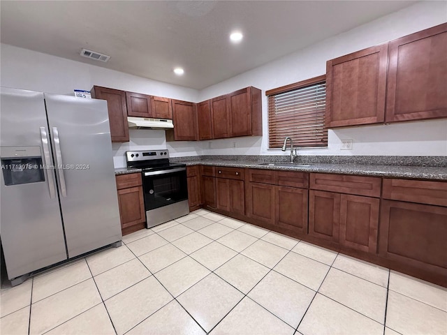 kitchen with sink, light tile patterned floors, and stainless steel appliances