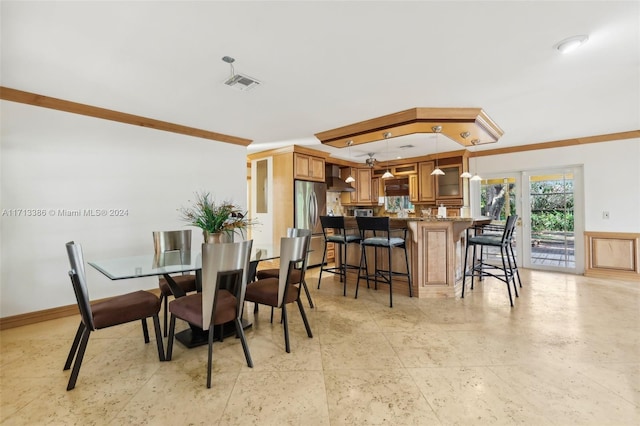 dining room with french doors and ornamental molding