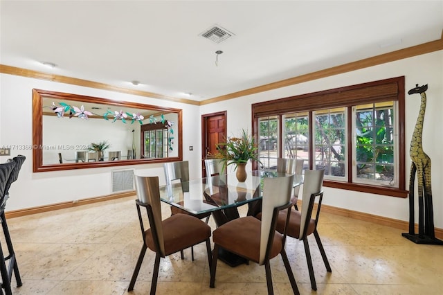 dining area with crown molding