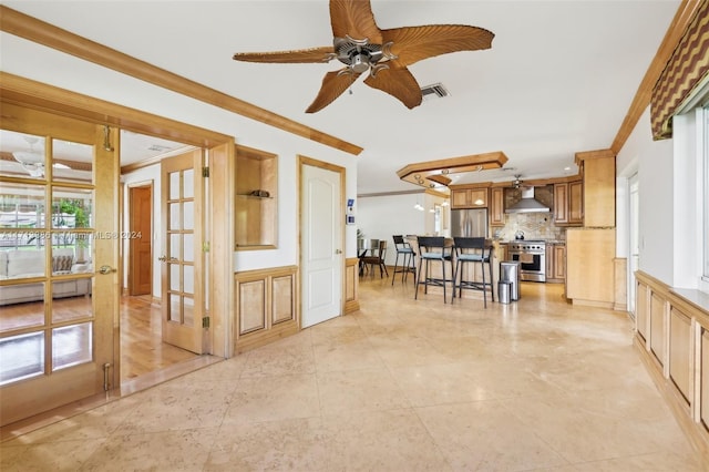 living room with crown molding, french doors, and ceiling fan