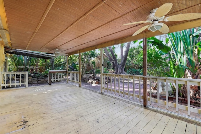 wooden terrace featuring ceiling fan