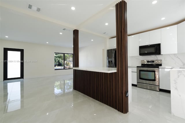 kitchen with ornate columns, white cabinetry, backsplash, dark brown cabinets, and black appliances