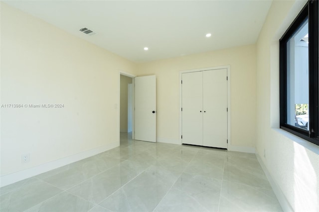 unfurnished bedroom featuring a closet