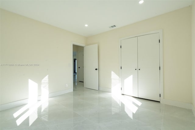 unfurnished bedroom featuring a closet