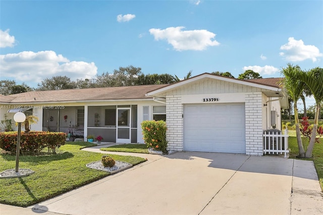 ranch-style house with a front lawn and a garage