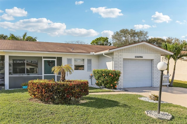 ranch-style house with a garage and a front yard