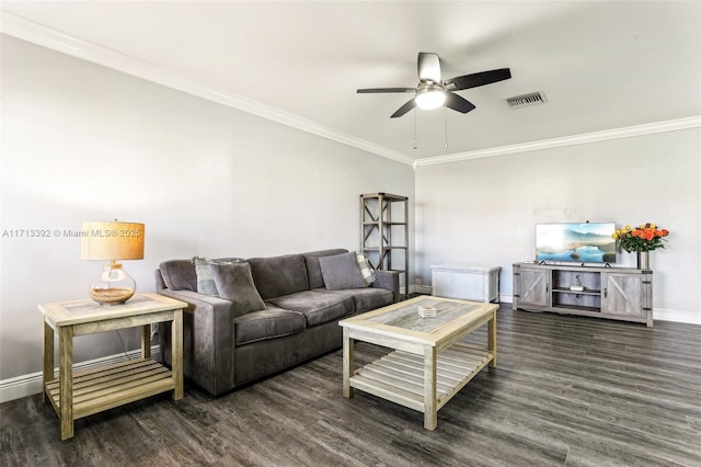 living room featuring dark hardwood / wood-style floors, ceiling fan, and crown molding