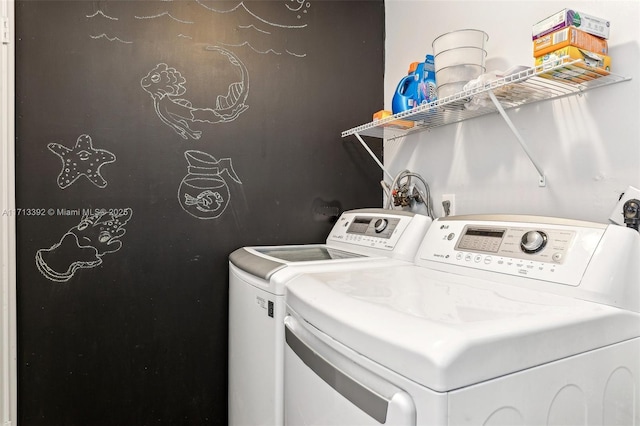 clothes washing area featuring washing machine and dryer