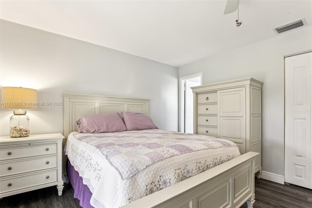 bedroom with dark wood-type flooring and ceiling fan