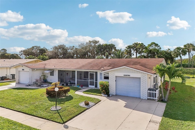 ranch-style house with a garage and a front lawn