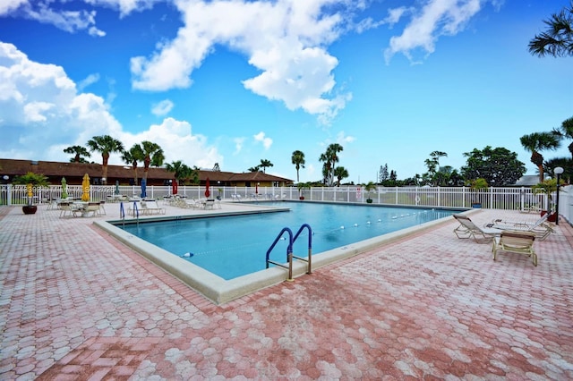 view of swimming pool with a patio