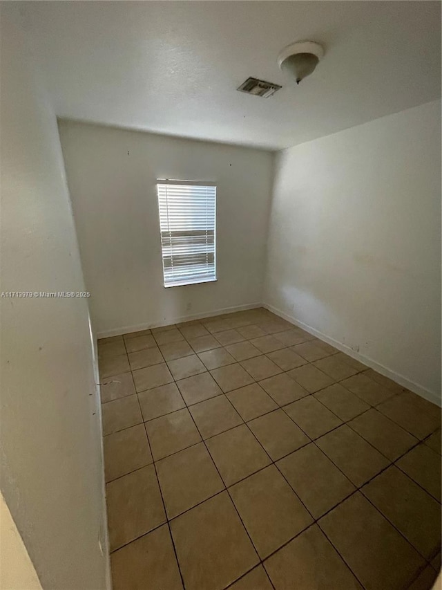 view of tiled spare room