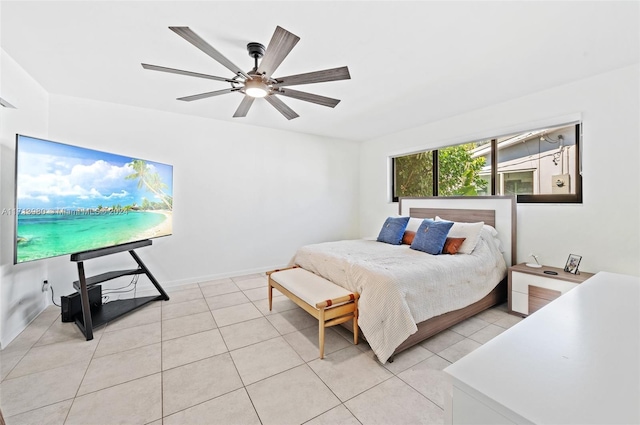 bedroom featuring ceiling fan and light tile patterned floors