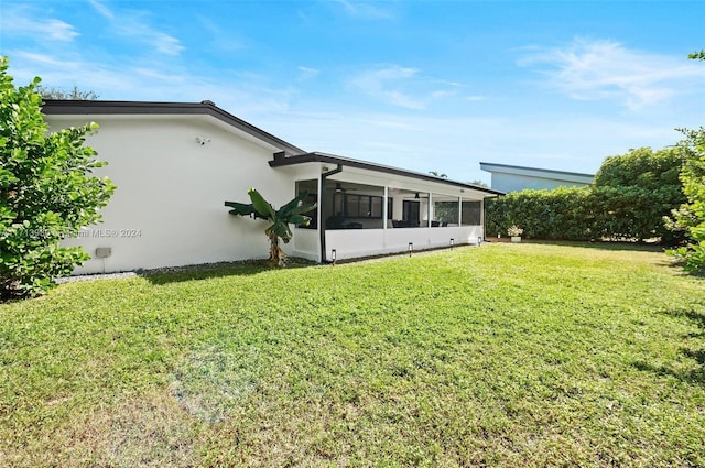 view of yard featuring a sunroom