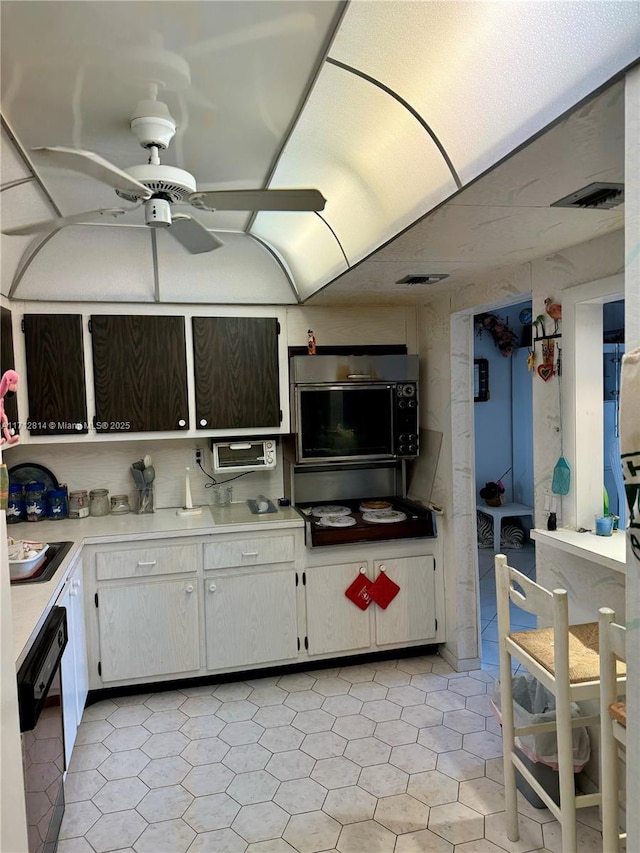 kitchen featuring white cabinetry, ceiling fan, dishwasher, and sink