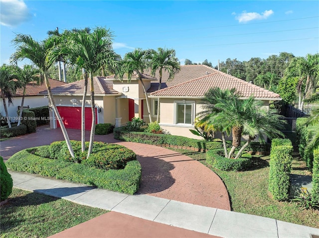 mediterranean / spanish-style home featuring a garage