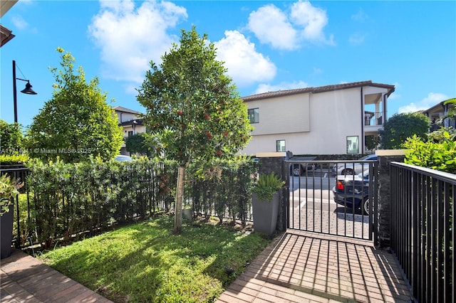 exterior space featuring fence and a gate