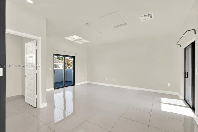 unfurnished room featuring light tile patterned floors