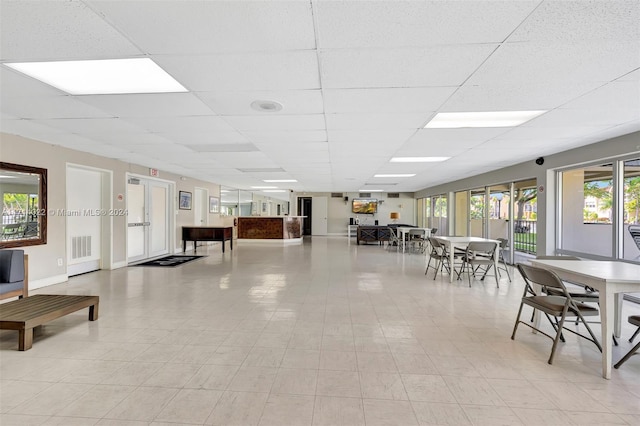 dining room featuring a drop ceiling