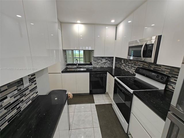 kitchen with white cabinets, sink, light tile patterned floors, white electric stove, and dishwasher